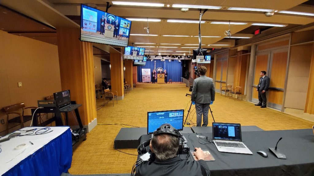 IMG production crew covering a Department of Justice press conference